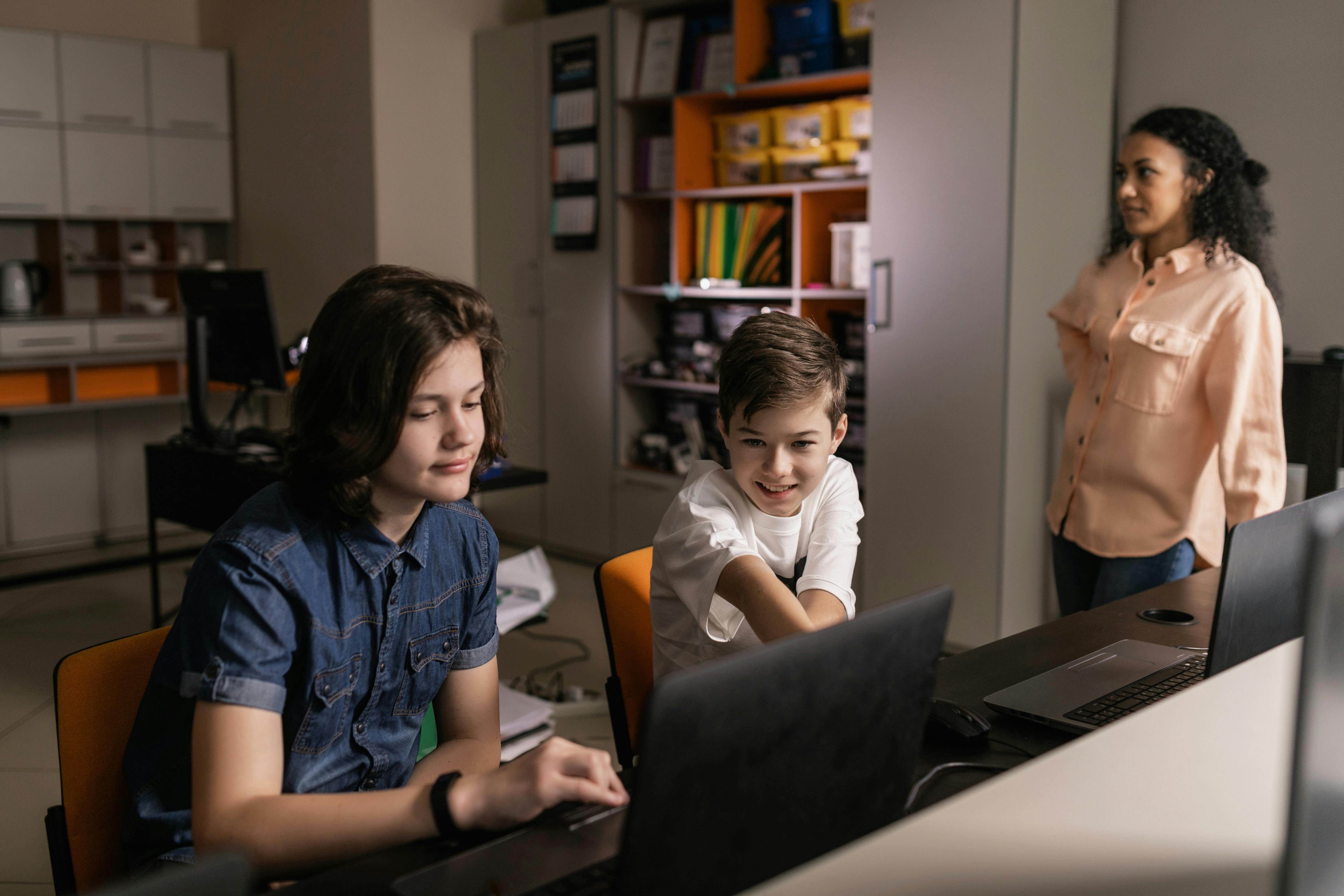 Students using laptops in a classroom
